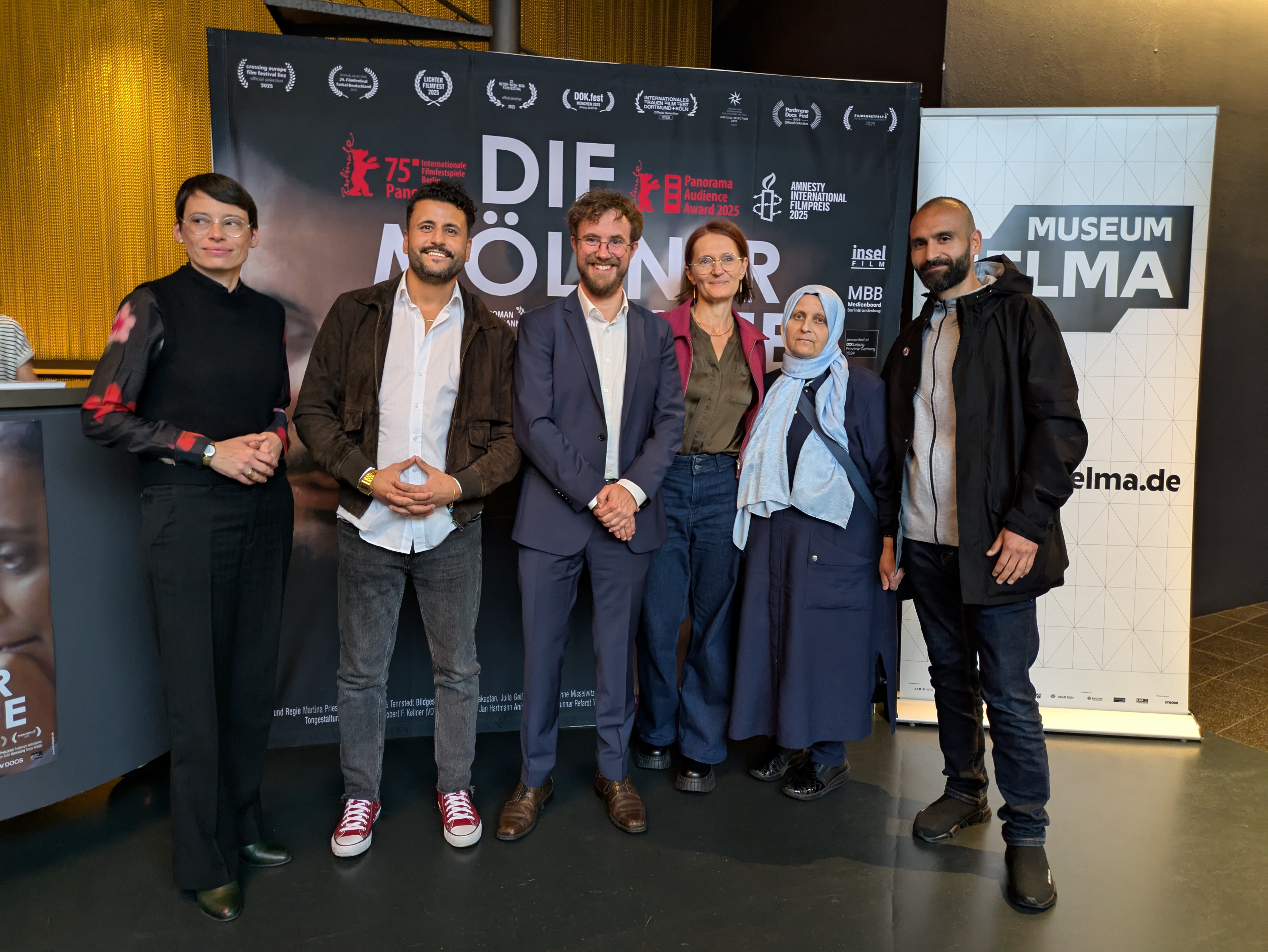 The Arslan family, Minister Paul and Dr Robert Fuchs (DOMiD) at the premiere in Cologne